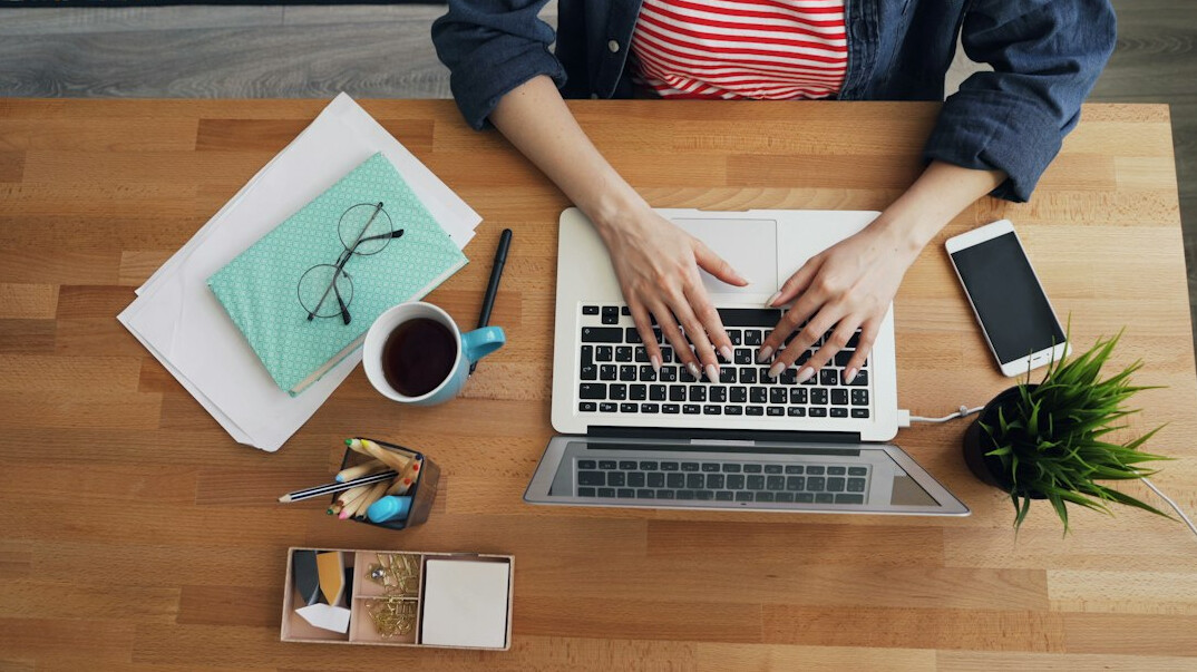 professional email writing at desk