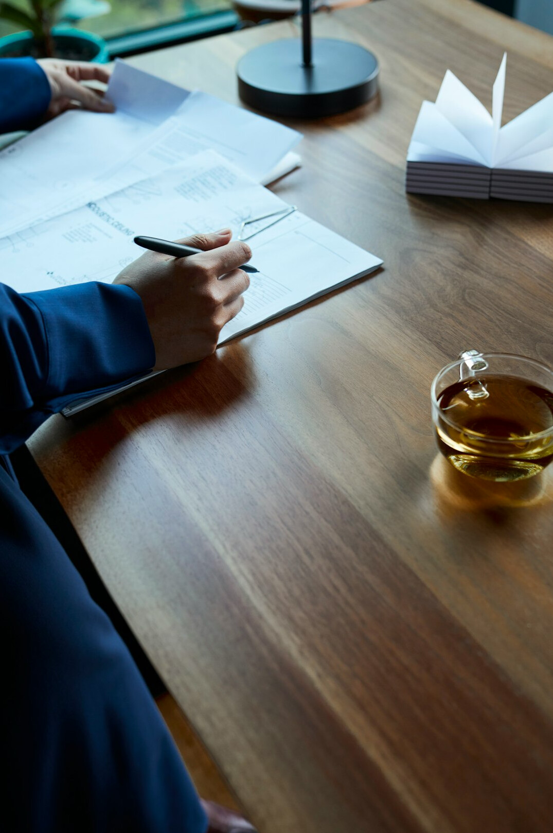 person preparing notes at desk