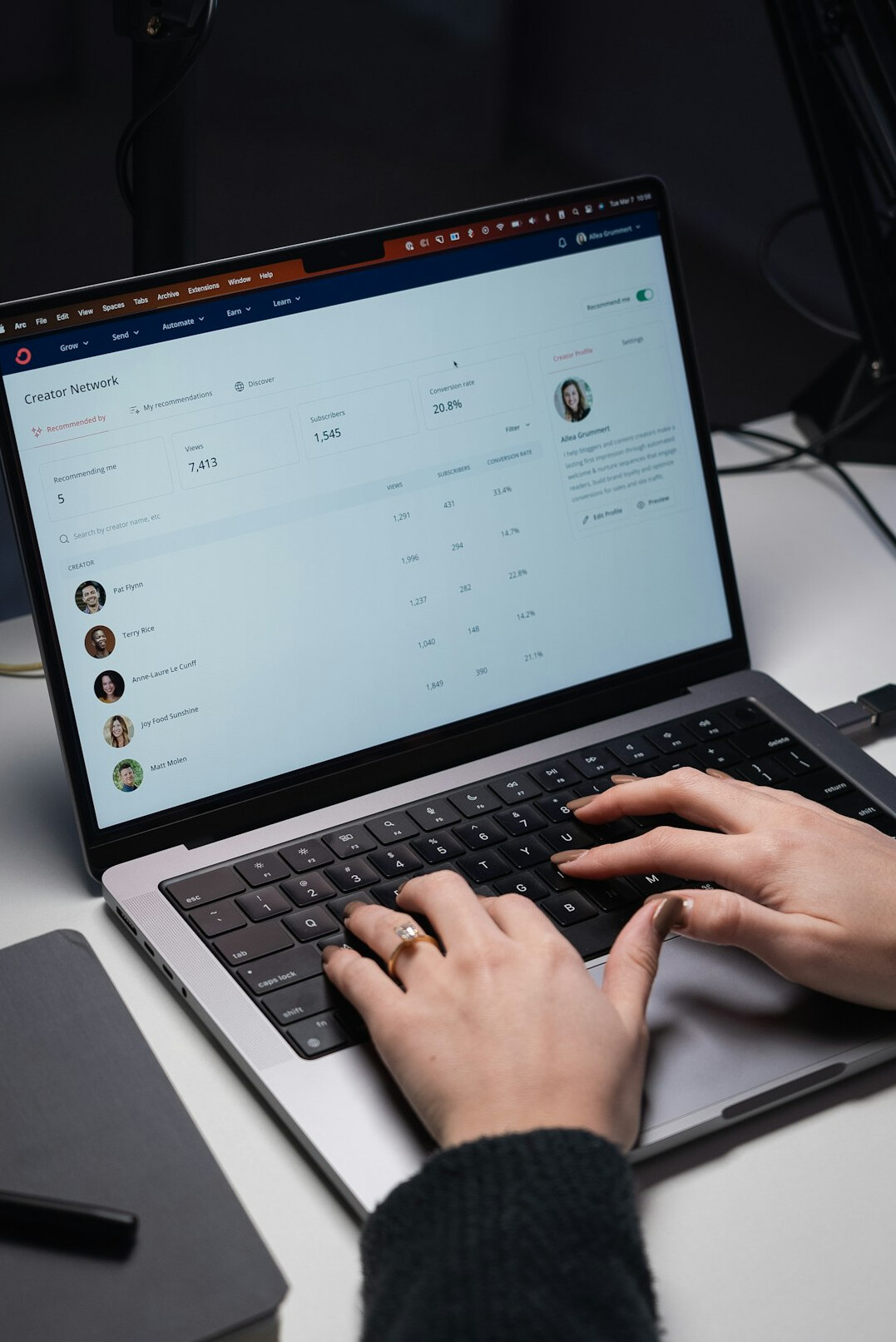 professional typing email on laptop
